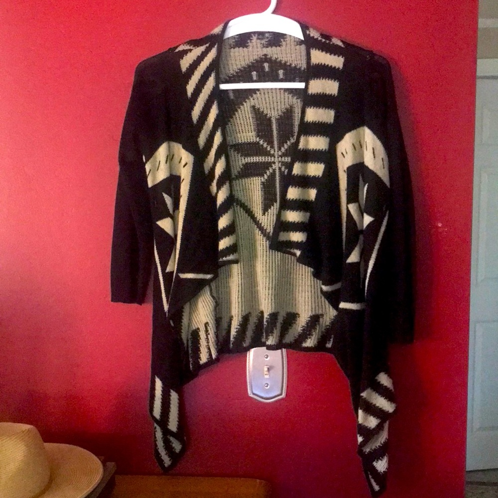 Aztec design, gently worn, low high style sweater.